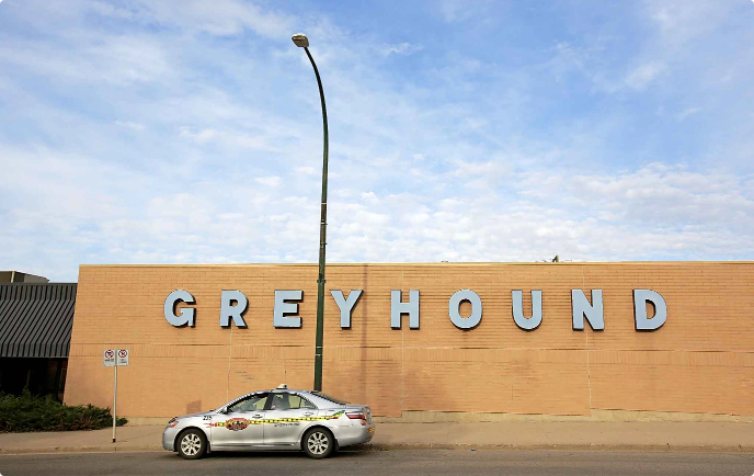 A taxi sits in front of the Greyhound bus depot on 6th Street in Brandon, Manitoba. The Greyhound building is up for sale. Photo courtesy of Tim Smith/The Brandon Sun.