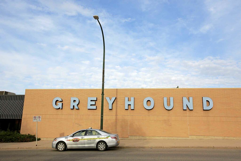 Brandon Sun 24052017 A taxi sits in front the Greyhound bus depot on 6th Street in Brandon on Wednesday evening. The Greyhound building is up for sale. (Tim Smith/The Brandon Sun)