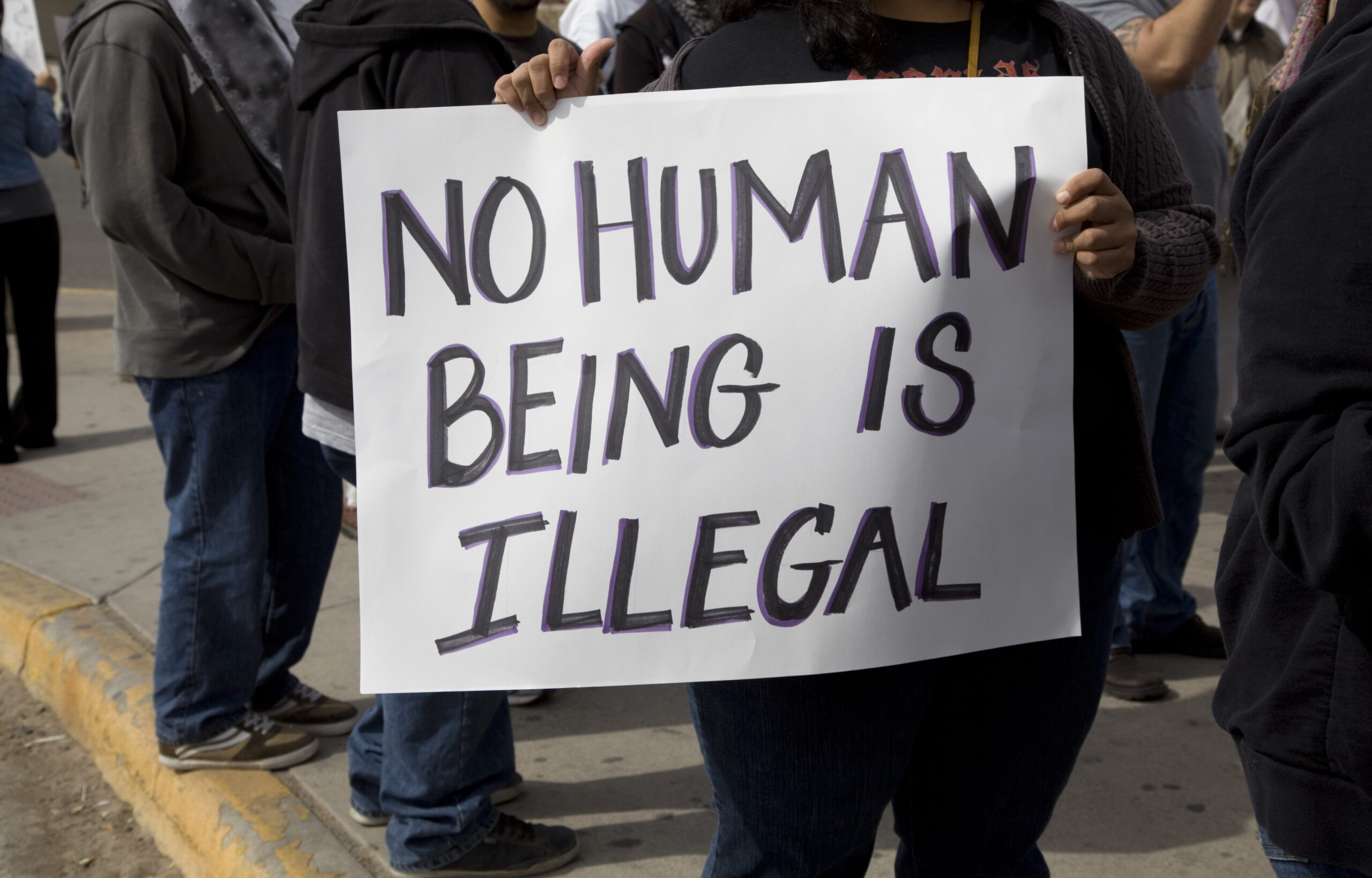 Sign reading No Human being is illegal,