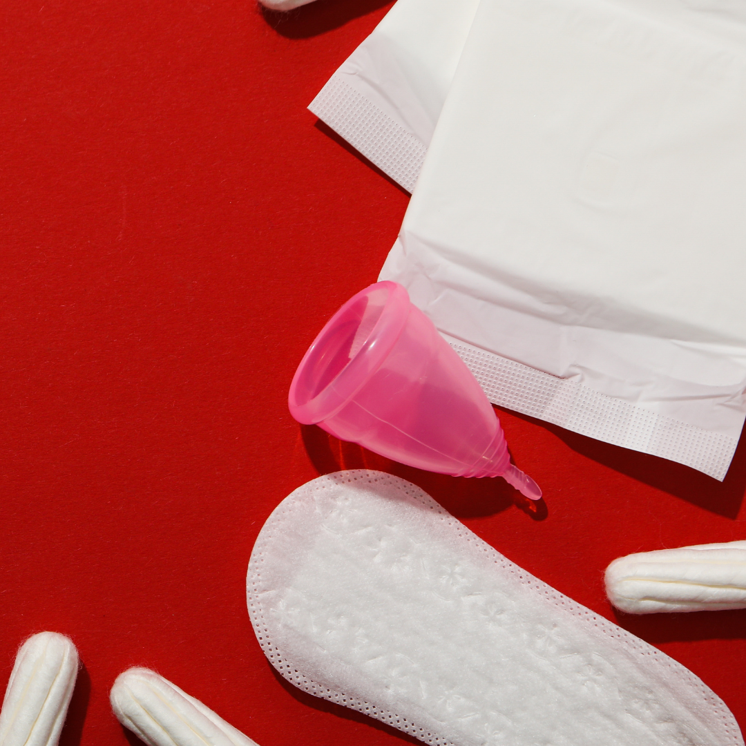 Image of various period supplies set against a red backdrop