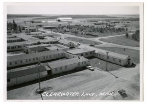 Image shows black and white pciture of Clearwater Lake Sanitorium, taken after 1947. You can see multiple buildings, houses in the middle. 
