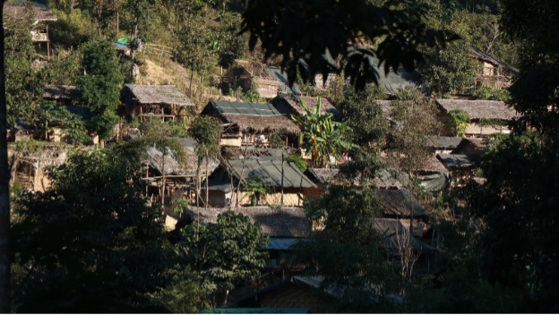 Image featuring housing on a hill in Myanmar. 