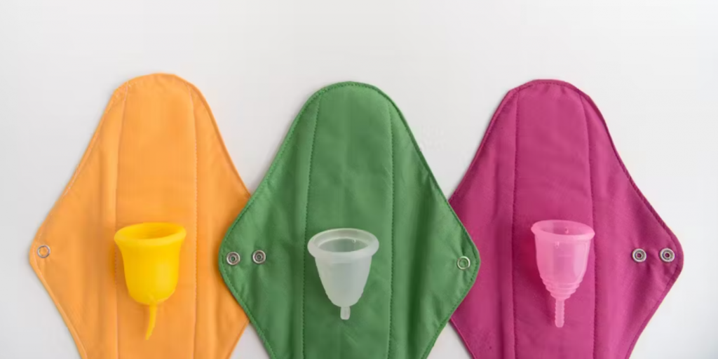 Image features perio supplies including three reusable pads and three menstrual cups.