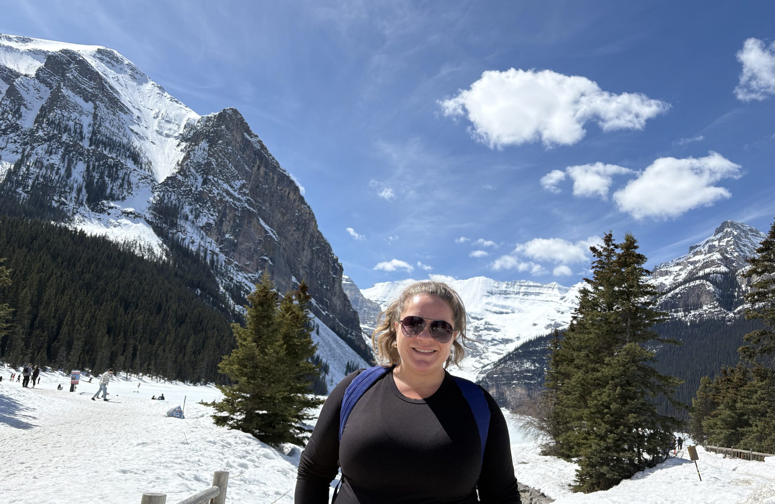 Suzanne Robertson standing in front of mountains.